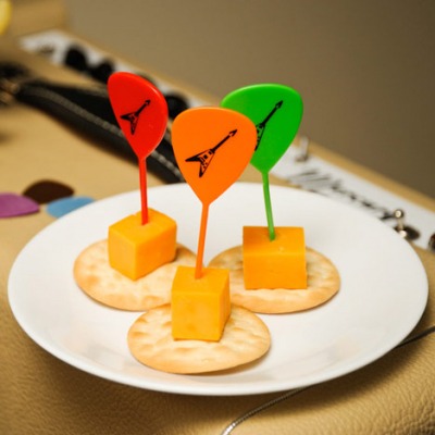 Guitar Pick Toothpicks with cheese and crackers on a plate