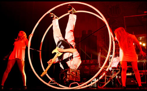 Inverted Guitarist Daniel Robert Angelo performing in the Circus of Horrors