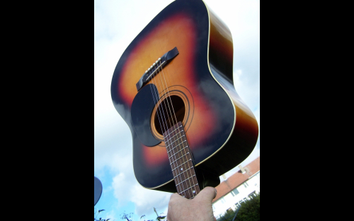 Tatra 9240 acoustic guitar from Czech Republic held aloft