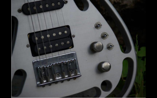 Abel Axe, aluminum body guitar, close up of switches and controls