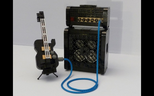 Black Les Paul electric guitar and amplifier
