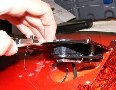 Squier telecaster bridge raised showing the underneath of the pickup