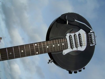 Bingham Vinyl Record Electric Guitar, raised aloft 