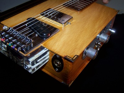 Tom Bingham's Book Guitar, closeup of bridge with supporting block
