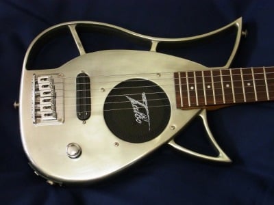 Cast aluminum guitar with built in amplifier